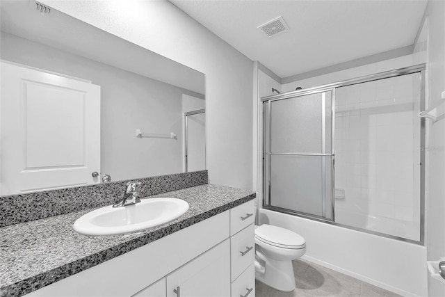 12907 Wildflower Meadow Dr, Riverview, FL 33579 - full bath with vanity, toilet, combined bath / shower with glass door, and tile patterned floors