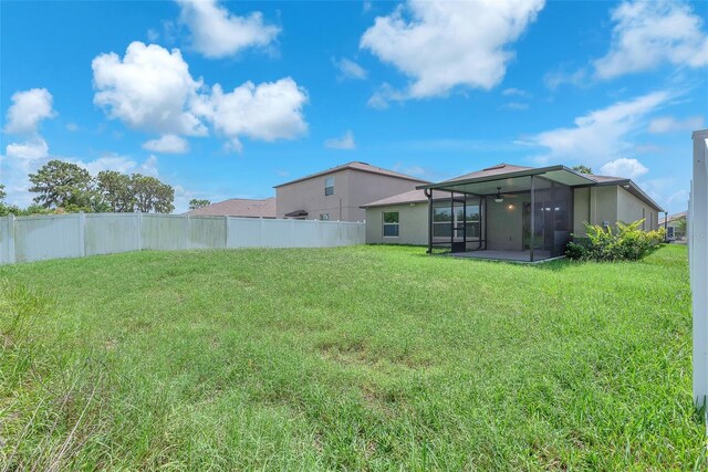 12907 Wildflower Meadow Dr, Riverview, FL 33579 - view of yard with a sunroom and ceiling fan