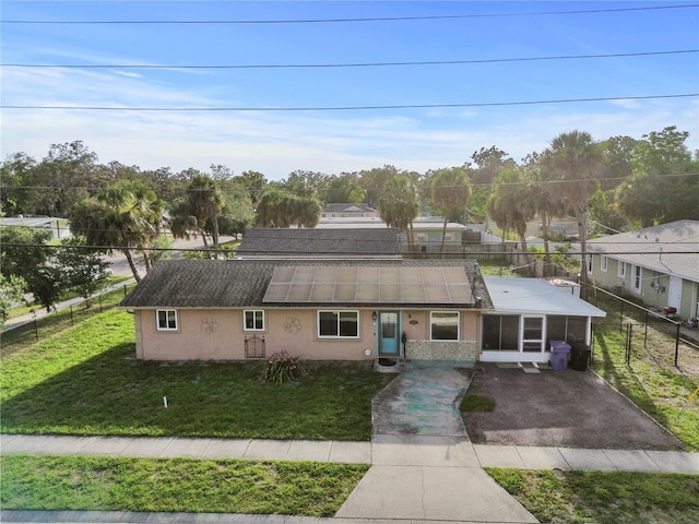 2501 18th Ave S, Saint Petersburg, FL 33712 - view of front facade featuring stucco siding and a sunroom