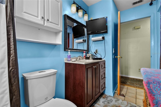2501 18th Ave S, Saint Petersburg, FL 33712 - bathroom featuring vanity, tile patterned floors, and toilet