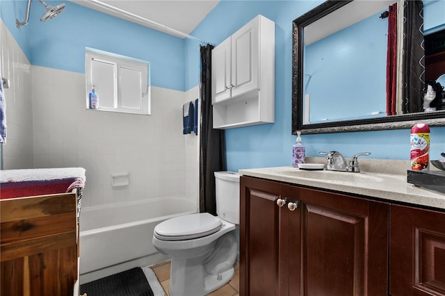 2501 18th Ave S, Saint Petersburg, FL 33712 - bathroom with toilet, vanity, shower / bath combo with shower curtain, and tile patterned flooring