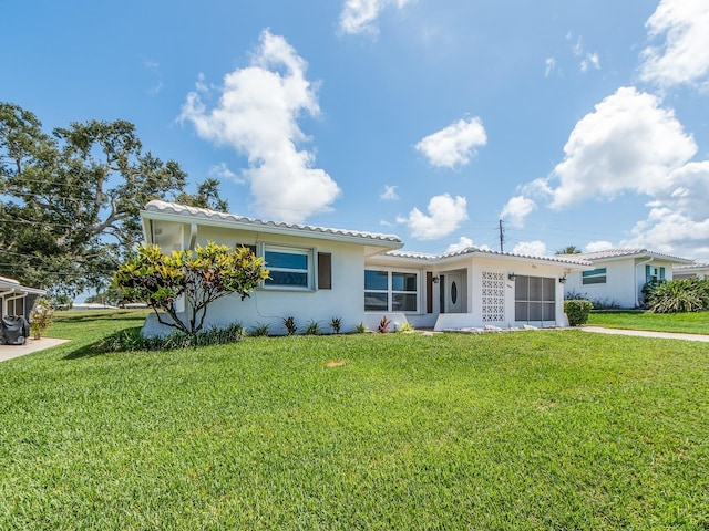 14045 90th Pl, Seminole, FL 33776 - single story home featuring stucco siding and a front yard