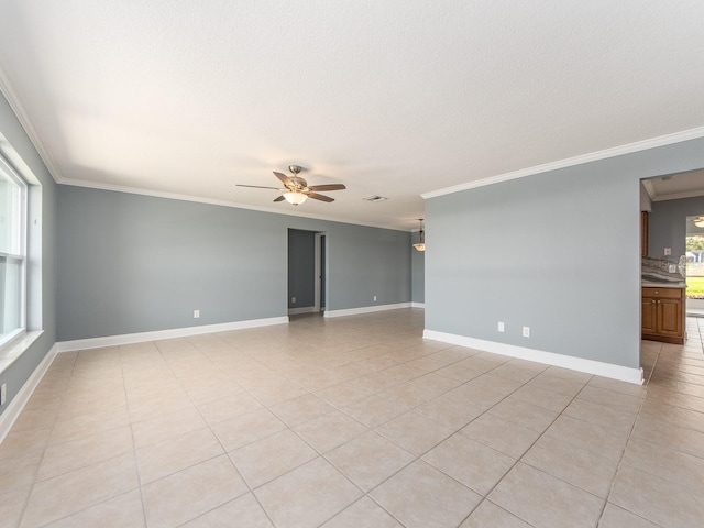 14045 90th Pl, Seminole, FL 33776 - empty room with crown molding, ceiling fan, light tile patterned floors, baseboards, and a textured ceiling