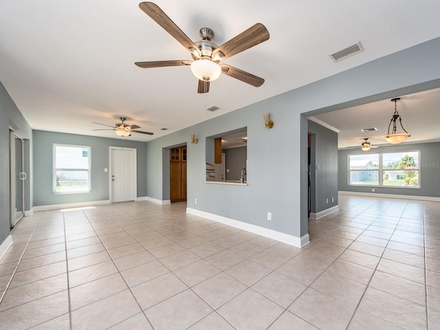 14045 90th Pl, Seminole, FL 33776 - spare room featuring a ceiling fan, light tile patterned flooring, and baseboards
