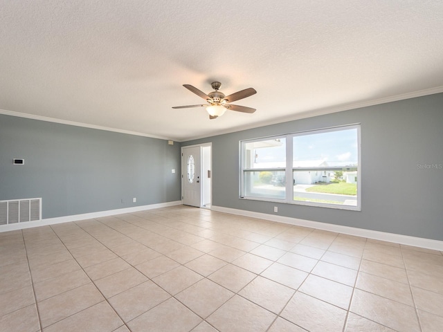14045 90th Pl, Seminole, FL 33776 - unfurnished room featuring ceiling fan, crown molding, light tile patterned floors, a textured ceiling, and baseboards