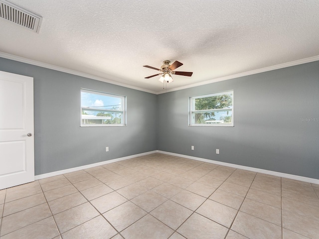 14045 90th Pl, Seminole, FL 33776 - spare room featuring crown molding, a ceiling fan, a textured ceiling, baseboards, and light tile patterned floors