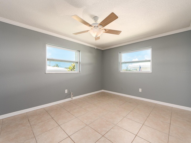 14045 90th Pl, Seminole, FL 33776 - spare room featuring healthy amount of natural light, crown molding, ceiling fan, a textured ceiling, and baseboards