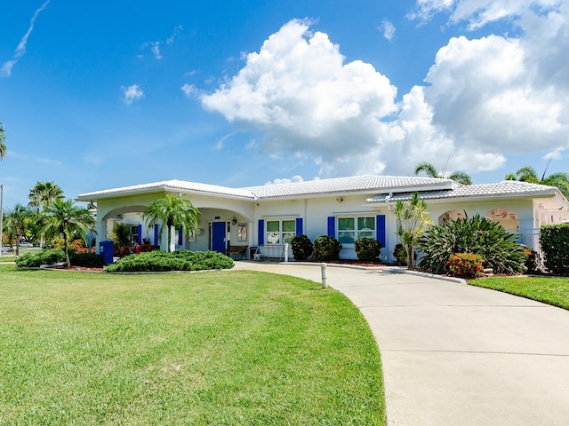 14045 90th Pl, Seminole, FL 33776 - ranch-style home with concrete driveway, a front lawn, stucco siding, and a tile roof