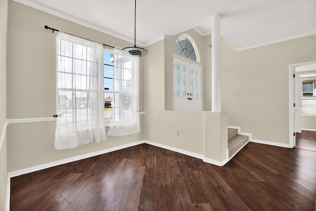 23917 Pow Wow Dr, Lutz, FL 33559 - unfurnished dining area with crown molding, wood finished floors, baseboards, and stairs