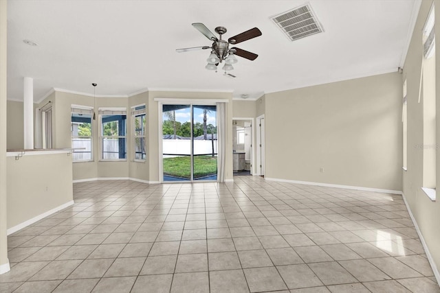 23917 Pow Wow Dr, Lutz, FL 33559 - unfurnished room with ceiling fan, baseboards, light tile patterned flooring, and crown molding