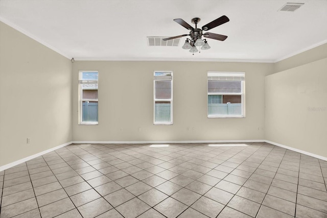 23917 Pow Wow Dr, Lutz, FL 33559 - spare room featuring ornamental molding, light tile patterned floors, a ceiling fan, and baseboards