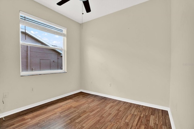 23917 Pow Wow Dr, Lutz, FL 33559 - unfurnished room featuring wood finished floors, baseboards, and a ceiling fan
