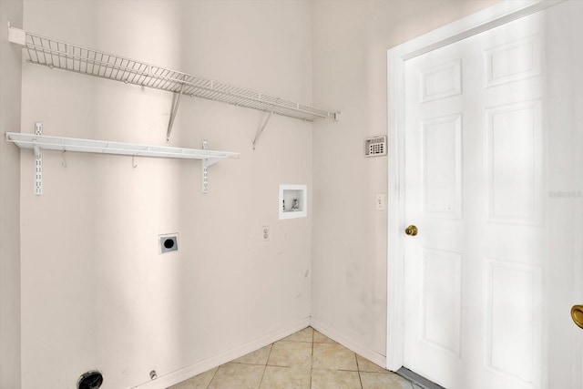 23917 Pow Wow Dr, Lutz, FL 33559 - laundry room featuring washer hookup, electric dryer hookup, light tile patterned floors, and baseboards