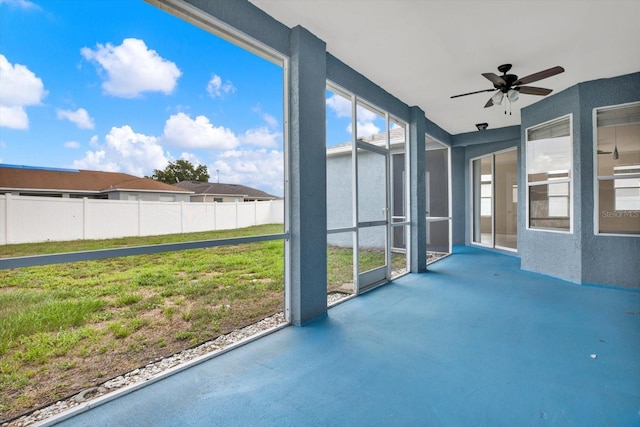 23917 Pow Wow Dr, Lutz, FL 33559 - unfurnished sunroom featuring a ceiling fan