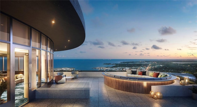 400 Central Ave Unit 2705, Saint Petersburg, FL 33701 - patio terrace at dusk with an outdoor living space and a water view