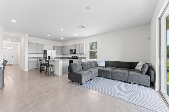 308 Mangrove Shade Cir, Apollo Beach, FL 33572 - living area with light tile patterned floors and recessed lighting