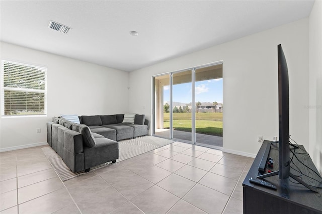 308 Mangrove Shade Cir, Apollo Beach, FL 33572 - living area featuring light tile patterned floors and healthy amount of natural light