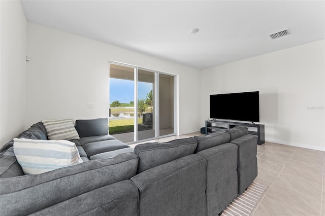 308 Mangrove Shade Cir, Apollo Beach, FL 33572 - living room with baseboards and light tile patterned floors