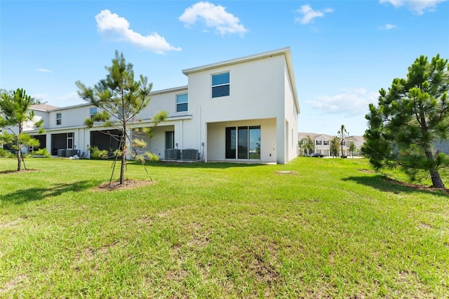 308 Mangrove Shade Cir, Apollo Beach, FL 33572 - rear view of house featuring stucco siding and a lawn