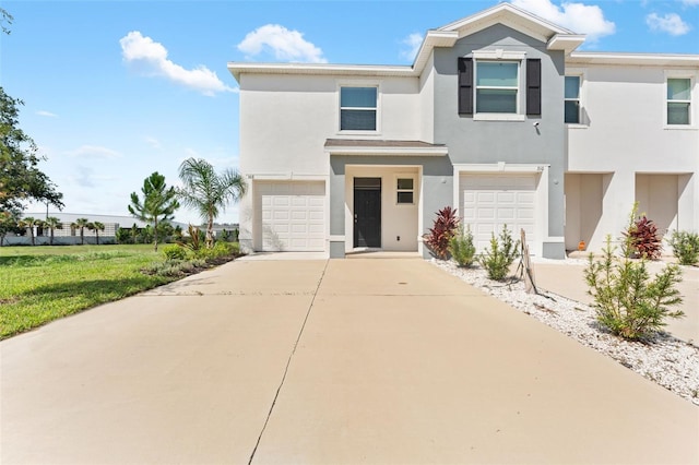308 Mangrove Shade Cir, Apollo Beach, FL 33572 - view of front facade with an attached garage, driveway, and stucco siding