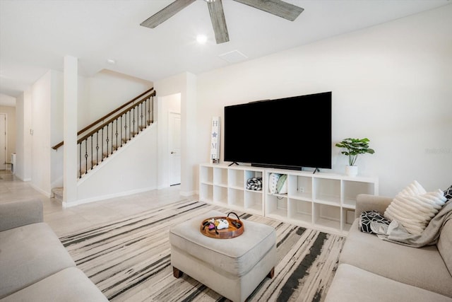13157 Peachleaf Ave, Riverview, FL 33579 - living area with stairs, a ceiling fan, and baseboards