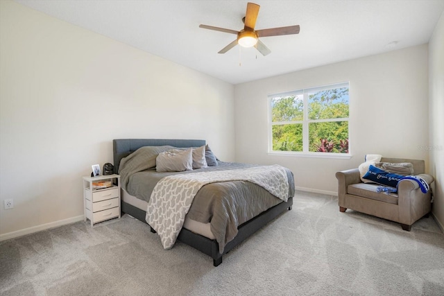 13157 Peachleaf Ave, Riverview, FL 33579 - bedroom featuring baseboards, light colored carpet, and a ceiling fan