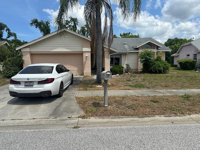 8635 Braxton Dr, Hudson, FL 34667 - ranch-style home with driveway and a garage