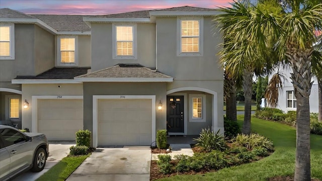 7916 Evergreen Creek Ct, Riverview, FL 33578 - view of front of property with stucco siding, concrete driveway, an attached garage, and a shingled roof