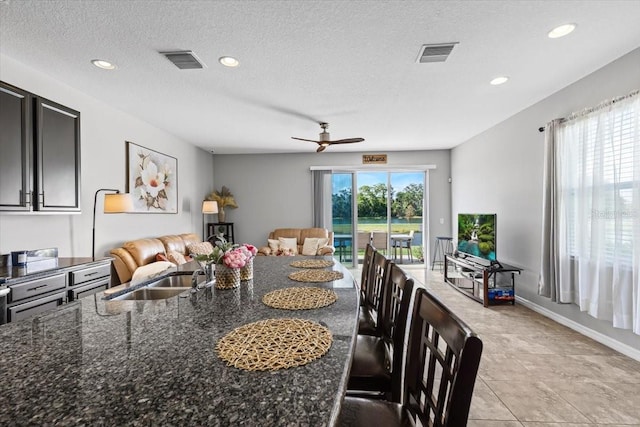 7916 Evergreen Creek Ct, Riverview, FL 33578 - dining room featuring a ceiling fan, recessed lighting, light tile patterned floors, and a textured ceiling