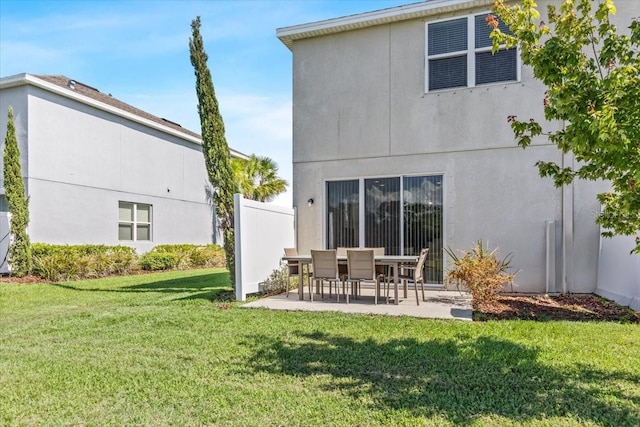 7916 Evergreen Creek Ct, Riverview, FL 33578 - back of house with a patio, a yard, and stucco siding