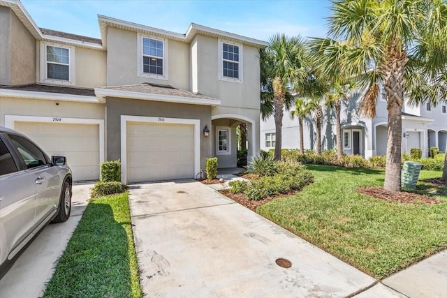 7916 Evergreen Creek Ct, Riverview, FL 33578 - view of property with a garage, stucco siding, a front lawn, and concrete driveway