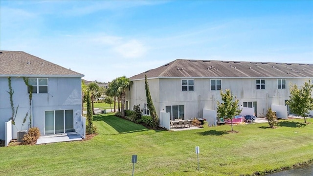 7916 Evergreen Creek Ct, Riverview, FL 33578 - back of house featuring a patio area, a lawn, and stucco siding