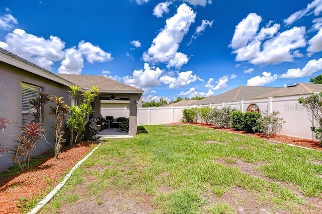 31349 Philmar Ln, Wesley Chapel, FL 33543 - fenced backyard featuring ceiling fan and a patio area