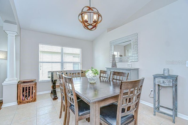 31349 Philmar Ln, Wesley Chapel, FL 33543 - dining area featuring ornate columns, lofted ceiling, light tile patterned floors, and a chandelier