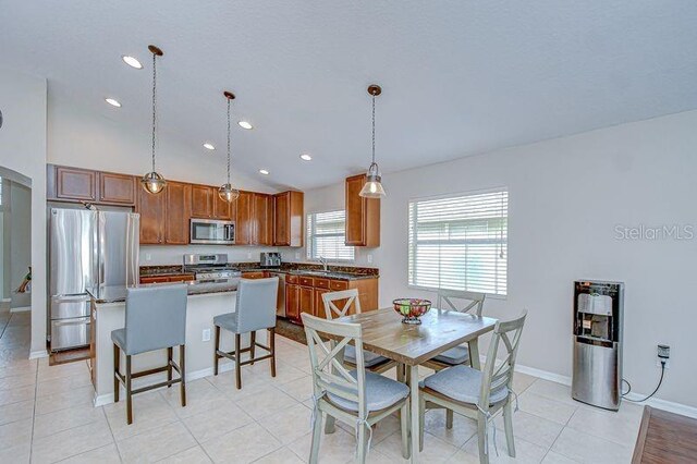 31349 Philmar Ln, Wesley Chapel, FL 33543 - dining room featuring recessed lighting, arched walkways, and light tile patterned floors