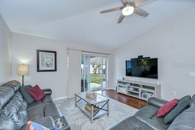 31349 Philmar Ln, Wesley Chapel, FL 33543 - living area with ceiling fan, vaulted ceiling, and wood finished floors