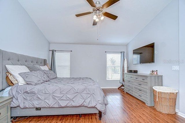 31349 Philmar Ln, Wesley Chapel, FL 33543 - bedroom featuring lofted ceiling, wood finished floors, and a ceiling fan