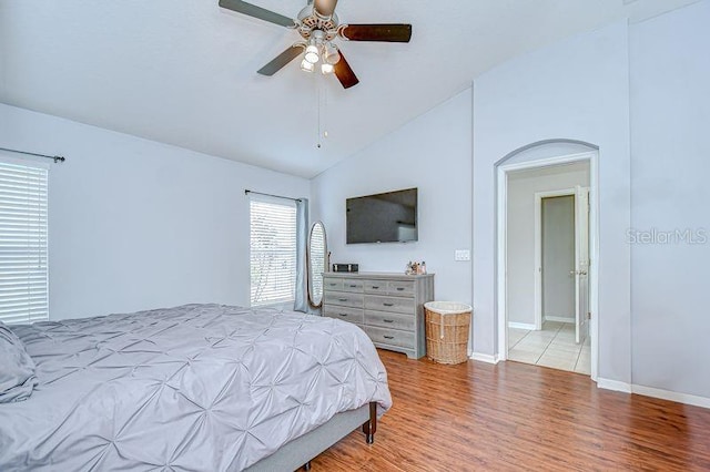 31349 Philmar Ln, Wesley Chapel, FL 33543 - bedroom with vaulted ceiling, wood finished floors, and ceiling fan