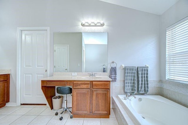 31349 Philmar Ln, Wesley Chapel, FL 33543 - bathroom featuring vanity, healthy amount of natural light, a garden tub, and tile patterned floors