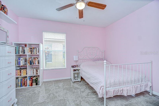 31349 Philmar Ln, Wesley Chapel, FL 33543 - bedroom featuring carpet floors and a ceiling fan