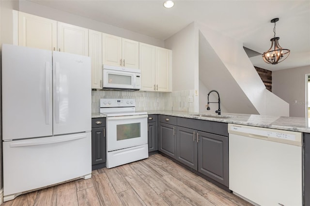 10966 Winter Crest Dr, Riverview, FL 33569 - kitchen featuring white appliances, gray cabinetry, a chandelier, decorative backsplash, and recessed lighting