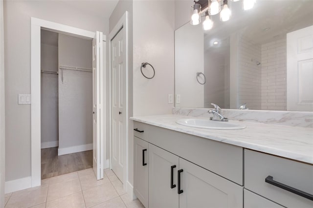 10966 Winter Crest Dr, Riverview, FL 33569 - full bathroom with vanity, tile patterned floors, a walk in closet, and a shower