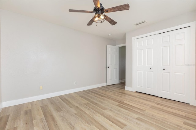 10966 Winter Crest Dr, Riverview, FL 33569 - unfurnished bedroom featuring light wood-style floors, a closet, and ceiling fan