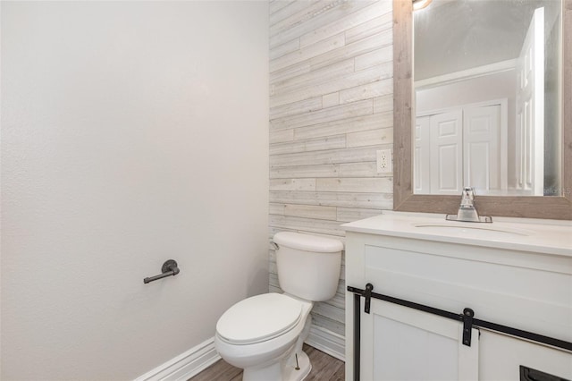 10966 Winter Crest Dr, Riverview, FL 33569 - half bath with vanity, wood walls, and wood finished floors