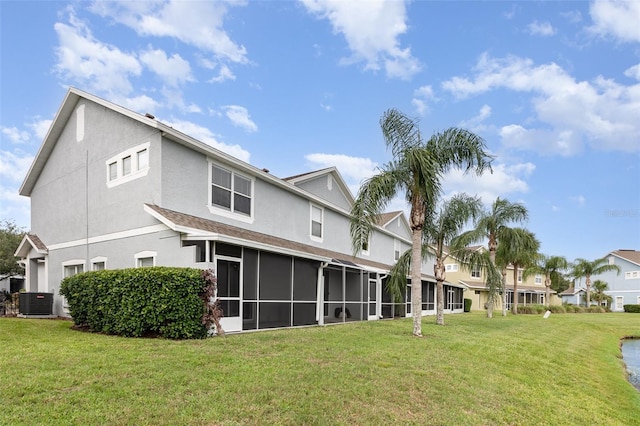10966 Winter Crest Dr, Riverview, FL 33569 - back of house featuring stucco siding, a yard, a sunroom, and a residential view