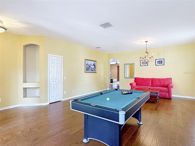 3824 Duke Firth St, Land O Lakes, FL 34638 - playroom with arched walkways, wood finished floors, billiards, and a chandelier