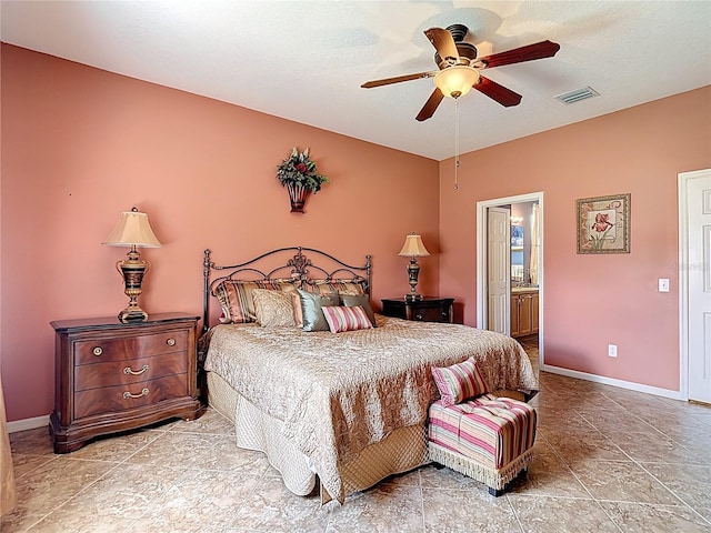 3824 Duke Firth St, Land O Lakes, FL 34638 - tiled bedroom featuring connected bathroom and ceiling fan