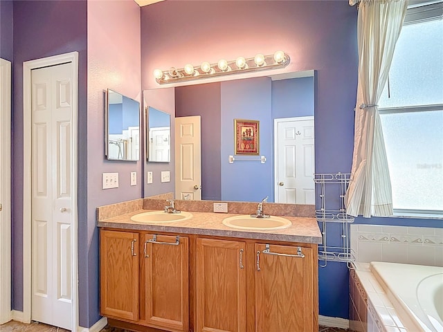 3824 Duke Firth St, Land O Lakes, FL 34638 - bathroom with double vanity, a bath, and a closet