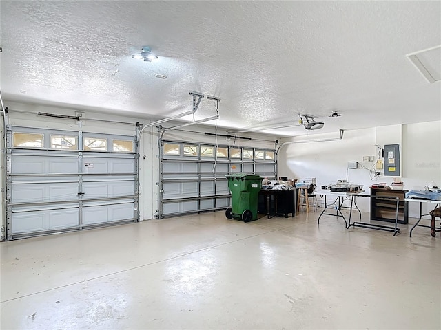 3824 Duke Firth St, Land O Lakes, FL 34638 - garage with electric panel and a garage door opener