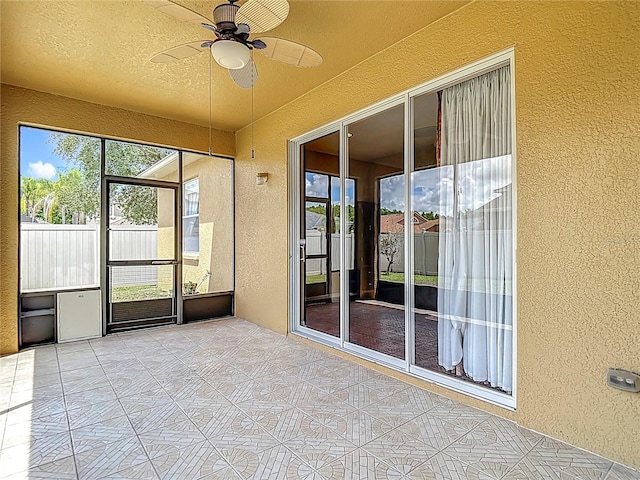 3824 Duke Firth St, Land O Lakes, FL 34638 - unfurnished sunroom with a ceiling fan
